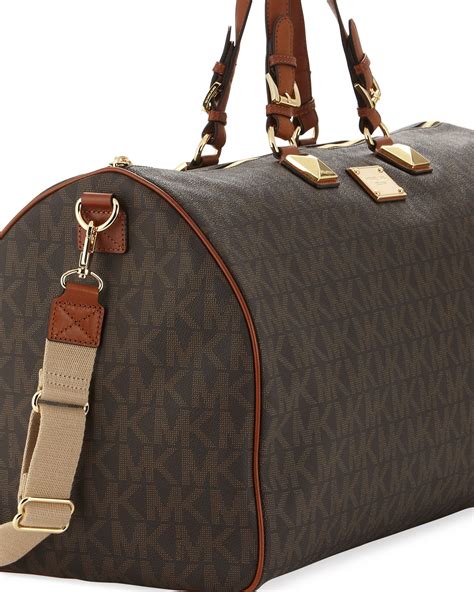 michael kors black duffel bag|Michael Kors large suitcase.